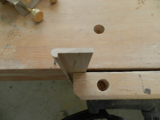 photo of profile of trim work piece to be attached to lower edge of the rail used to build the coffee table frame
