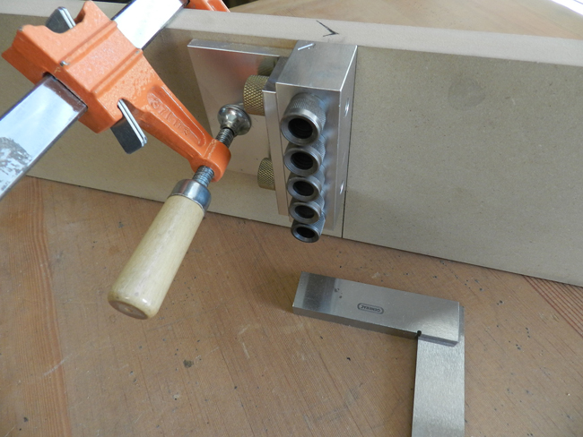 Dowelmax T-type face joint configuration aligned and clamped to drill the rail to cross member joints used to build the coffee table frame inner section