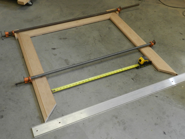 photo of tape for inside measurements used to check the accuracy of the mitered boards used to build coffee table top