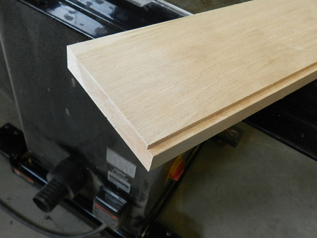 photo of recess for glass panels cut into inside edge of board used to build the coffee table top