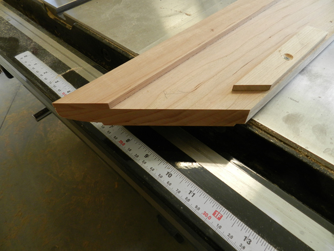 photo of slats to provide a thicker appearance attached to lower surface of boards used to build the coffee table top