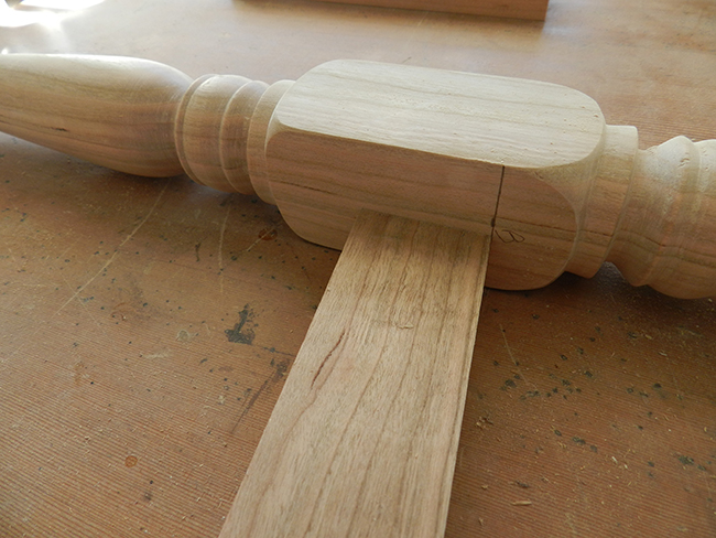 photo of lower rail of stool cut to length with a 6 degree angle at each end to align with the pencil mark on the leg