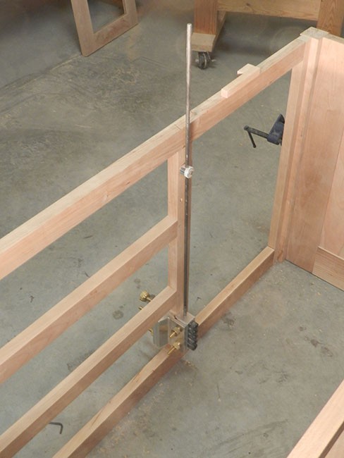 dowelmax-and-distance-gauge-used-to-reference-TV-stand-bulkhead-dowel-bores