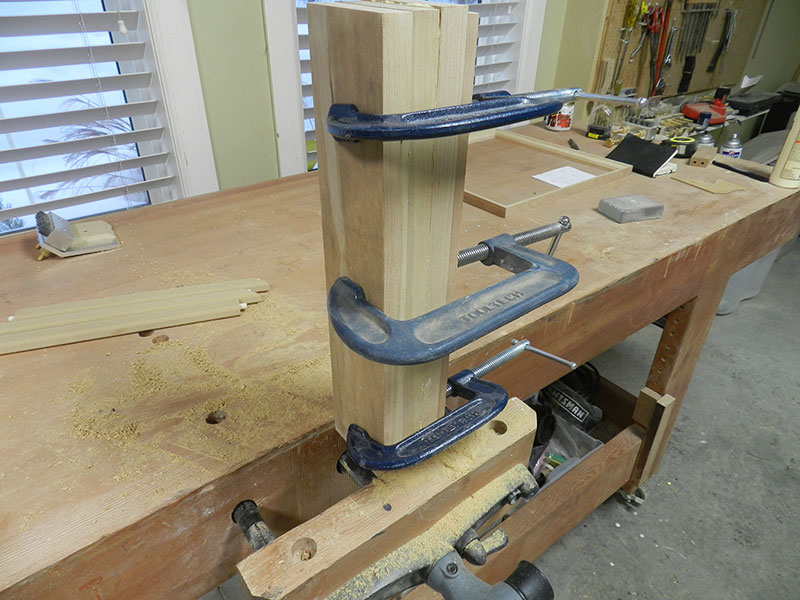 Three cherry work pieces glued and clamped together into one piece for construction of the Chippendale feet.