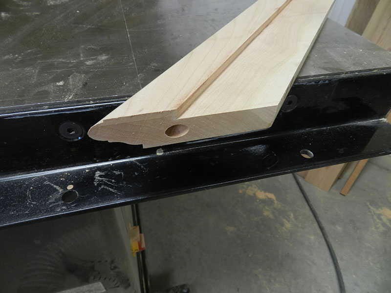 photograph of dowel joint bore in mitered end of rail used to build the entryway table top assembly perimeter section