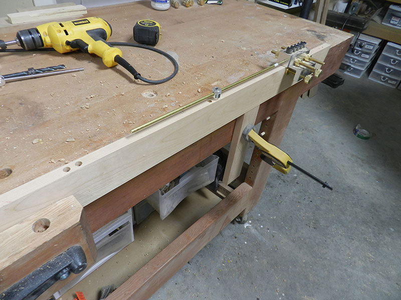 Photograph of dowel joint bores on rear rail used to build the entryway table top assembly rear perimeter section aligned using Dowelmax and distance gauge.