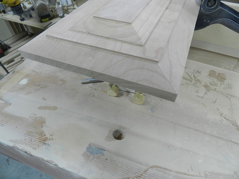 photo of beveled top plate added to surface of main panel to build the armoire drawer assembly front fascia