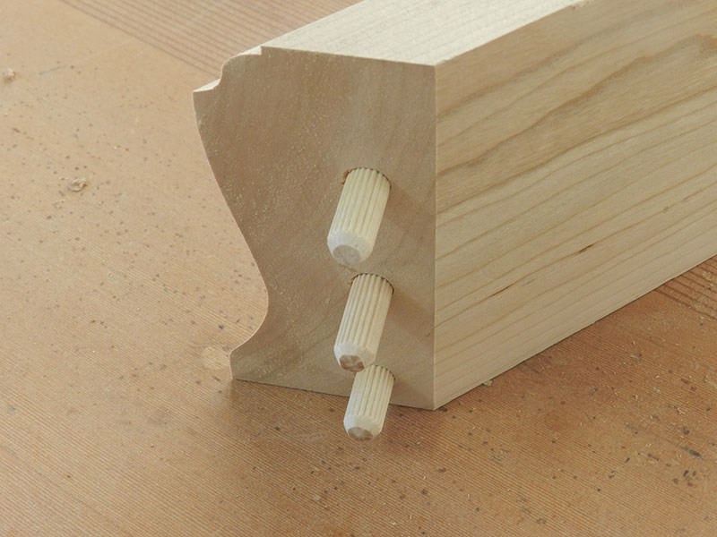 photo of detail of the multiple dowel miter joint used to build the armoire chippendale feet