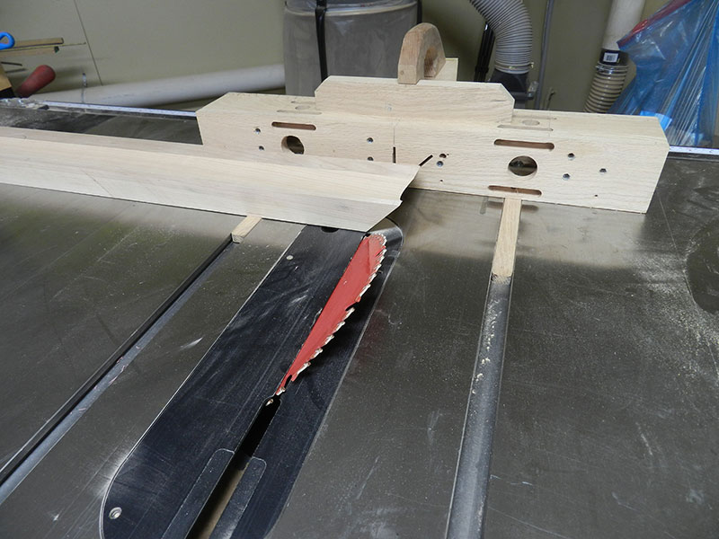 photo of the mitered work piece used to build the armoire chippendale feet cut in the table saw using a shop made sled