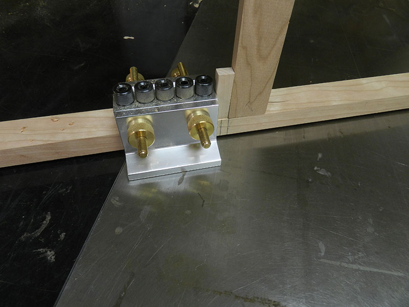 photo of cut off piece of drawer rail used as spacer between drawer guides used to build the armoire frame assembly drawer support sections