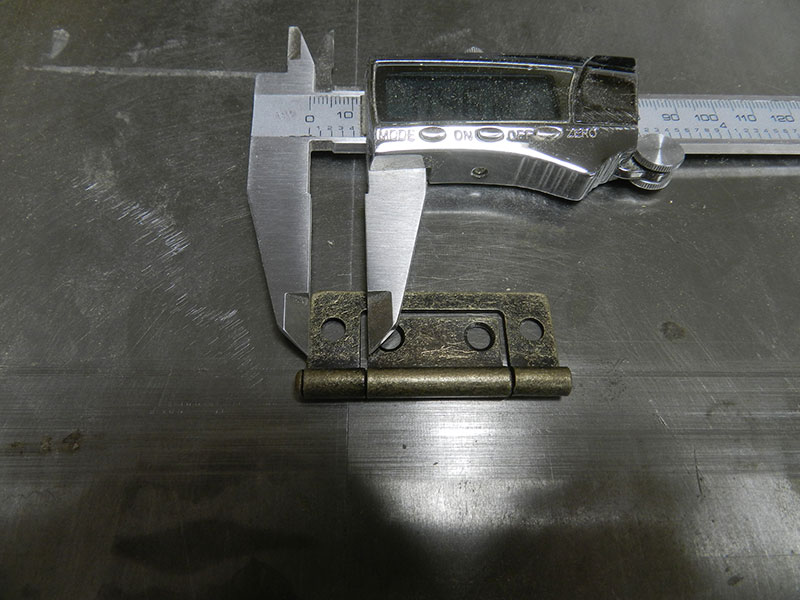 photo of Richelieu bronze hinge for installation of the raised panel doors used to build the armoire frame assembly upper media storage section