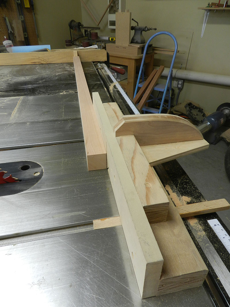 photo of one of the vertical pillars used to build the armoire frame assembly corner sections trimmed to length in the table saw using a shop made sled