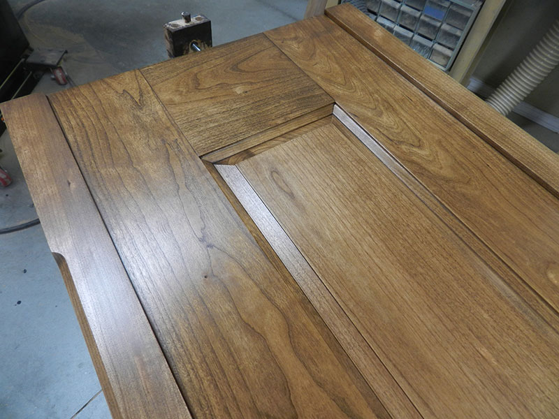 photo of completed raised panel and corner post assembly used to build the armoire frame side section after finishing with walnut and espresso stain mix