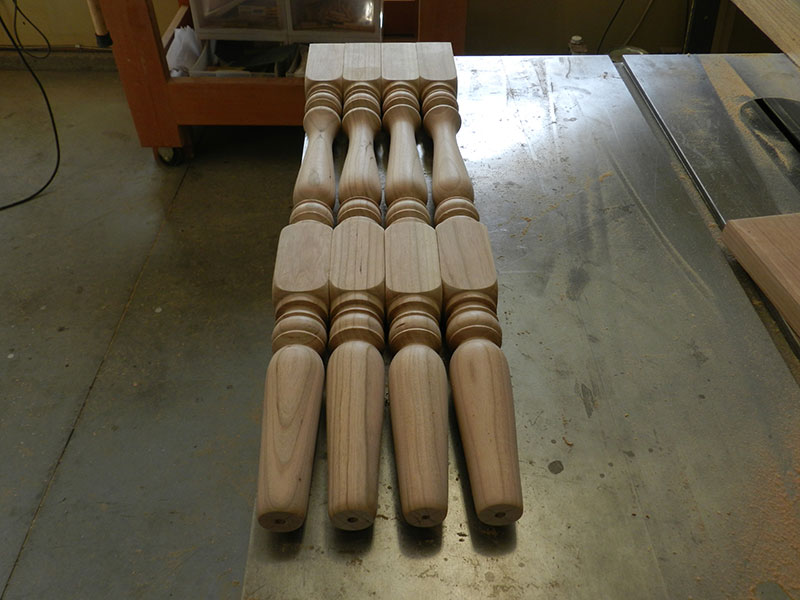 photo of the four completed turned legs used to build the counter stool frame