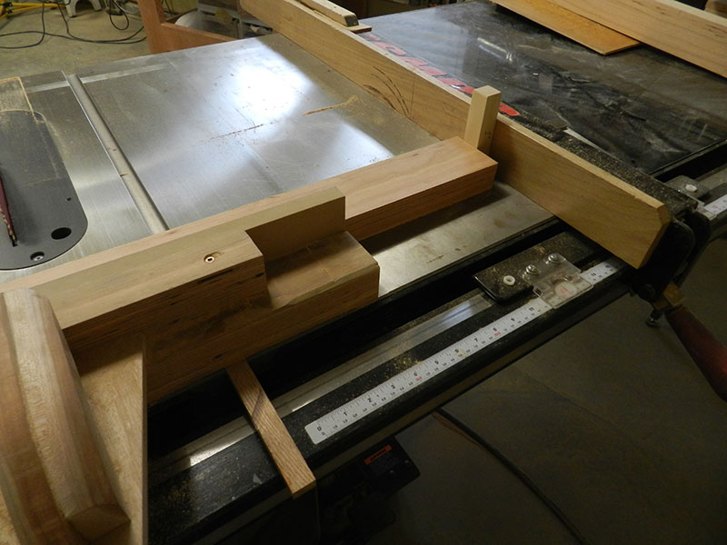 photo of shop made table saw sled with stop arrangement for accurately cutting the legs used to build the counter stool frame assembly