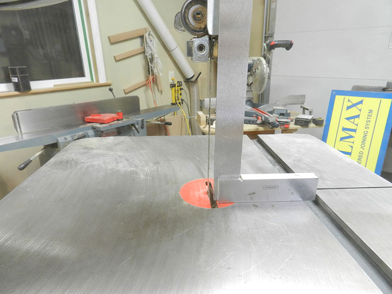 photo of checking the band saw blade perpendicular to the cast iron saw base with a set square prior to cutting the cabriole leg shape