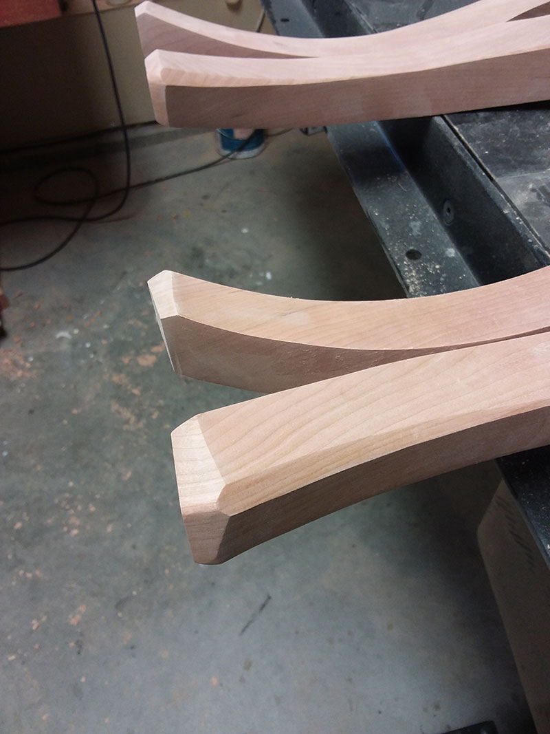 photo of the feet of the cabriole legs used to build the bedroom table frame after shaping with the belt sander and by hand