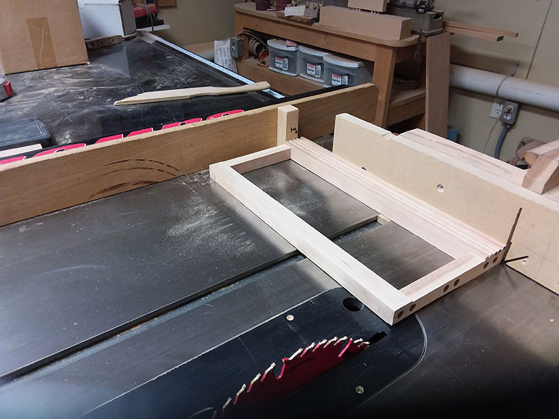 photo of the drawer fascia used to build the bedroom table frame front section trimmed to length in the table saw