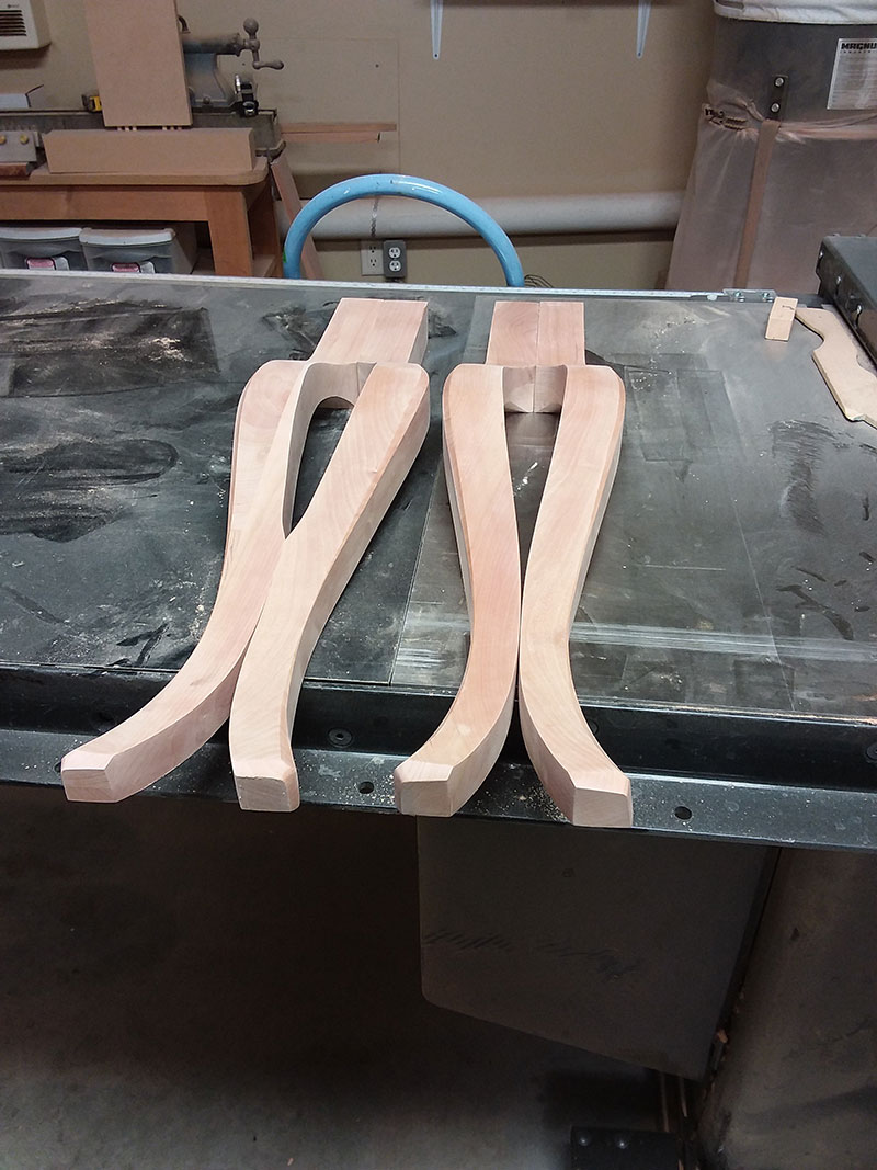 photo of the cabriole legs used to build the bedroom table frame assembly, front legs on the right and rear legs on the left