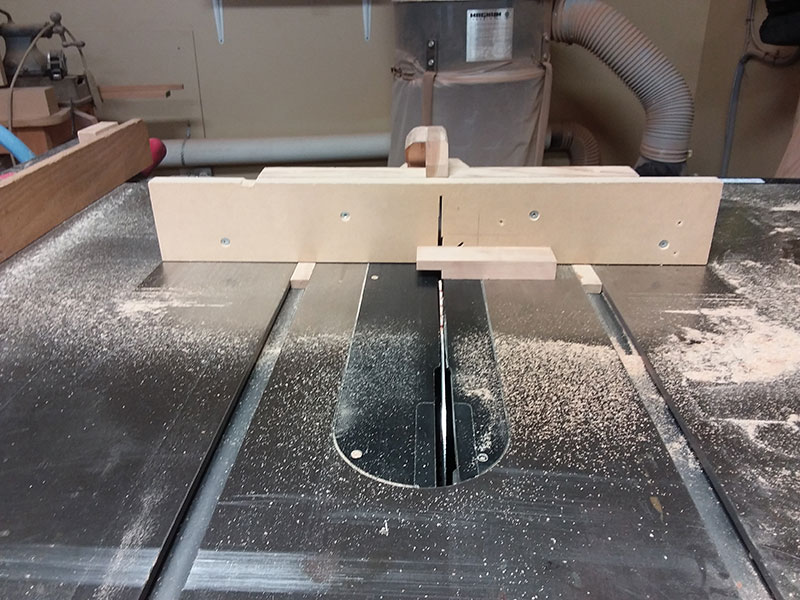 photo of cutting the half lap joints used to build the bedroom table drawer fascia with the table saw sled