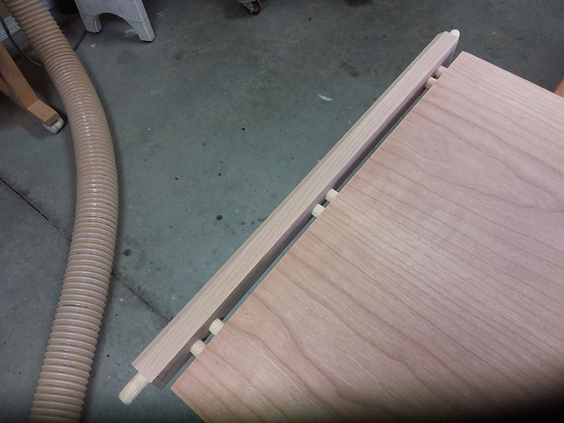photo of the lower rail rail to shelf dowel joint used to build the bedside table frame assembly lower section