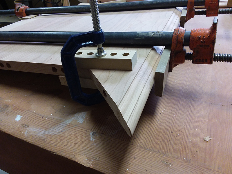 photo of method of clamping mitered rails used to build the bedside table top perimeter section