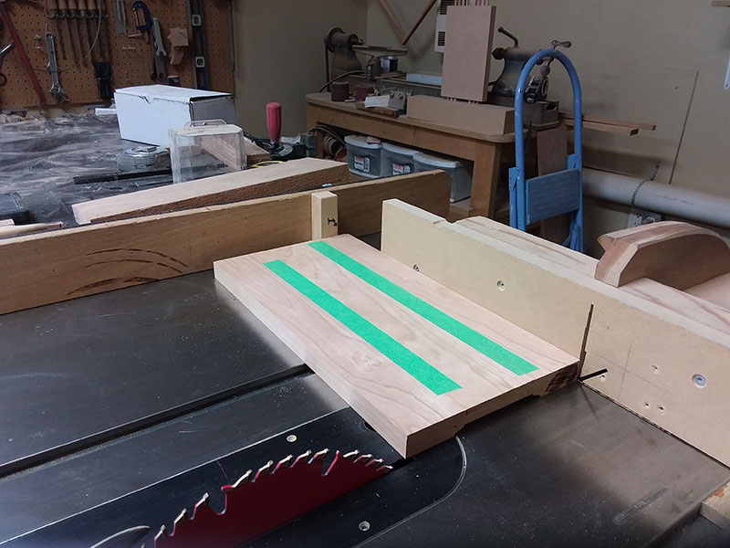 photo of painters tape laid along joint seams of rails and center panel used to build the bedside table frame side sections