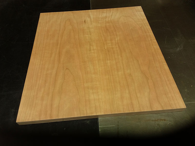 photo of two work pieces joined edge to edge with six dowels to build the bedside table shelf assembly